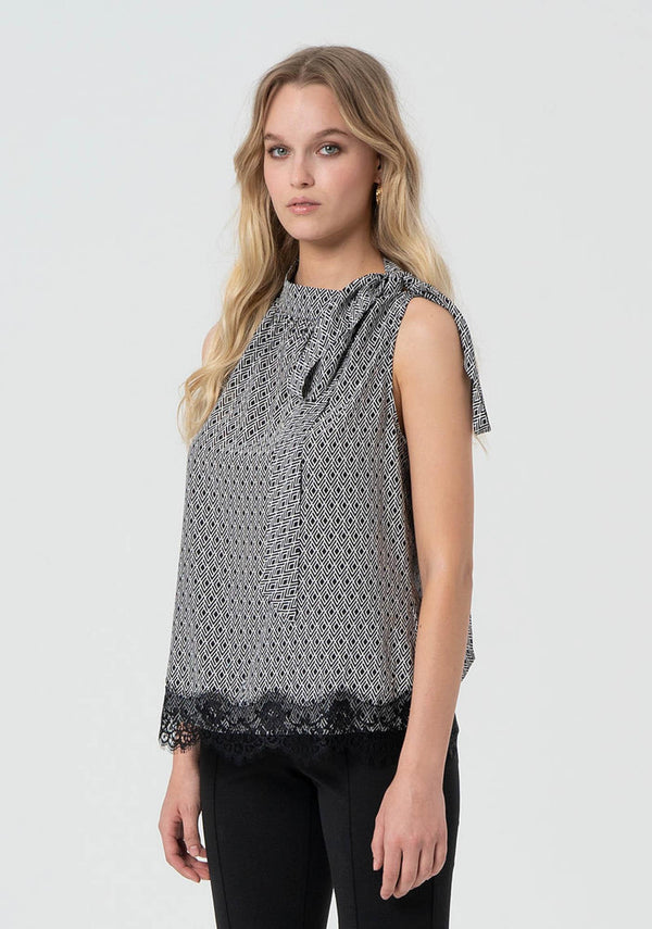 Top donna fantasia geometrica con dettaglio fiocco