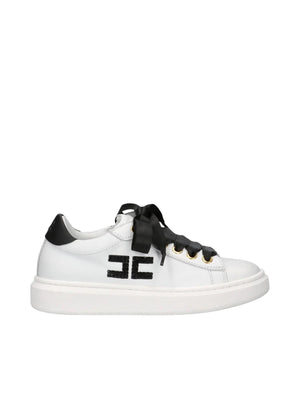 Sneakers bambina in pelle bianca e nera con fiocchi