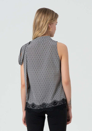 Top donna fantasia geometrica con dettaglio fiocco
