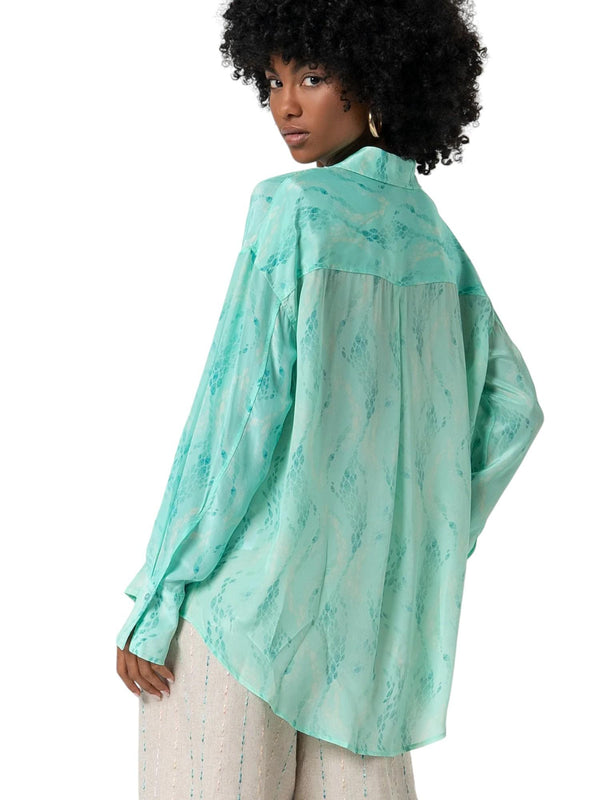 Camicia donna turchese in tessuto lucido stampato