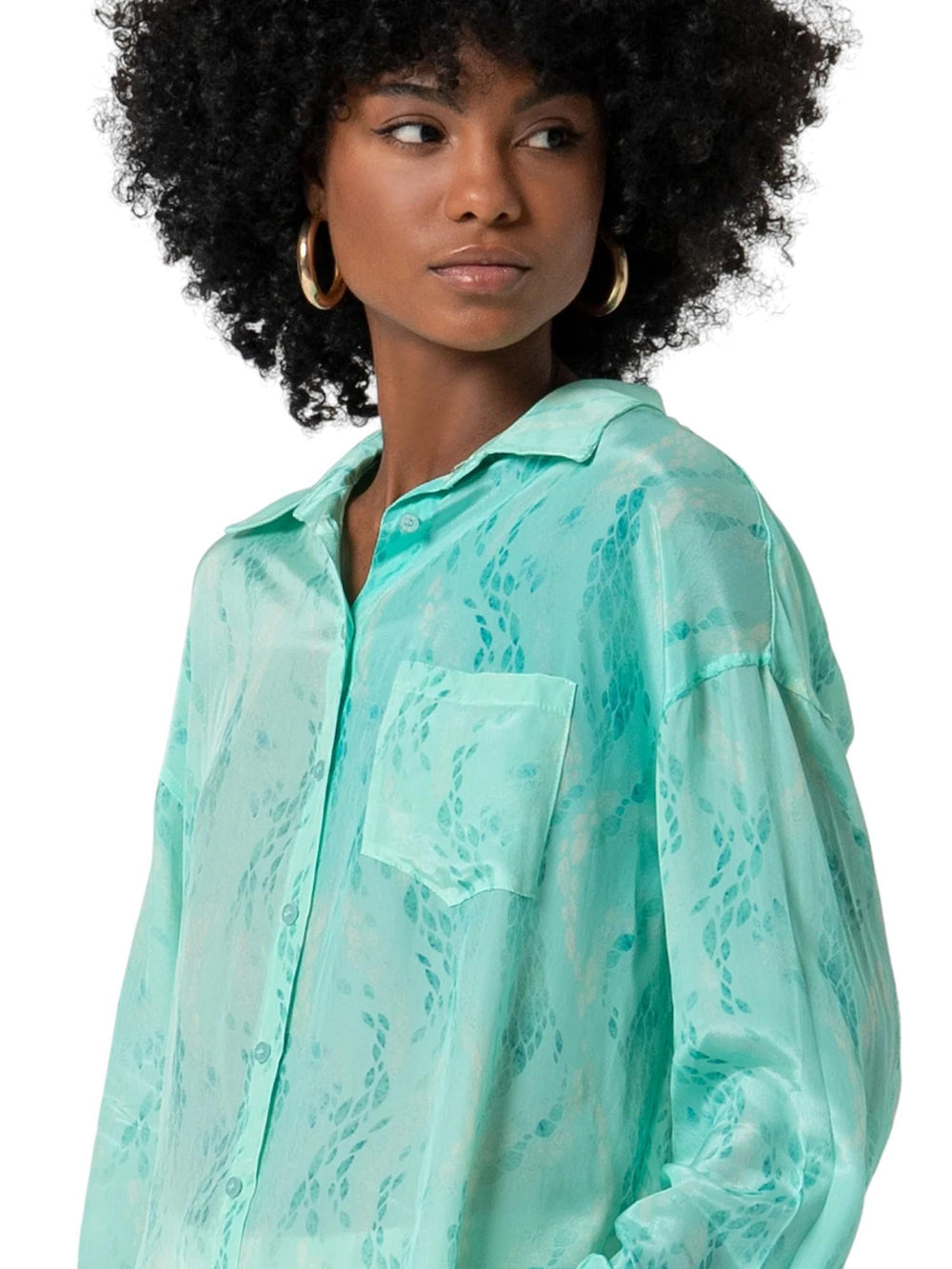 Camicia donna turchese in tessuto lucido stampato