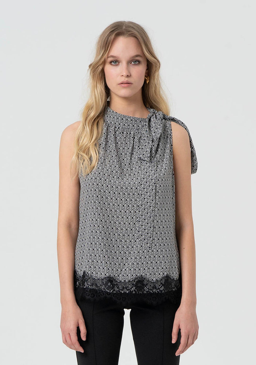 Top donna fantasia geometrica con dettaglio fiocco