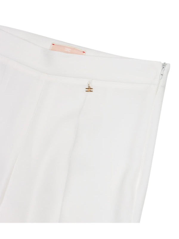 Pantaloni bambina flare bianchi con pinces sartoriali