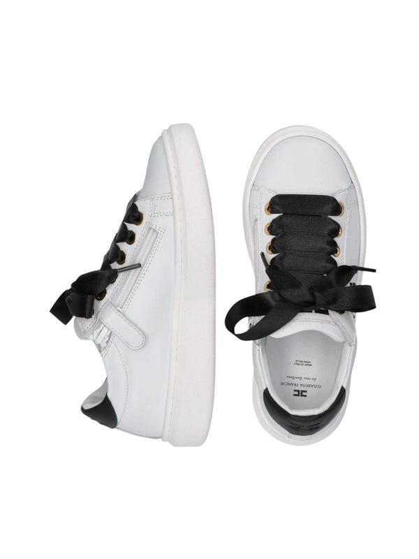Sneakers bambina in pelle bianca e nera con fiocchi