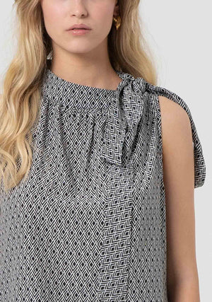 Top donna fantasia geometrica con dettaglio fiocco