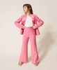 Pantaloni flare in crêpe con spacchi