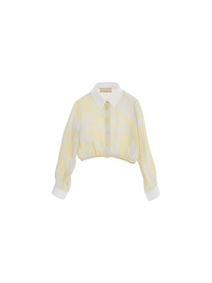 Camicia bambina gialla cropped con stampa floreale