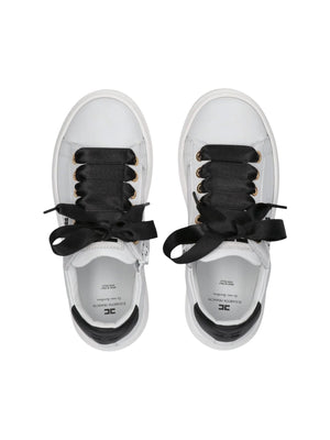 Sneakers bambina in pelle bianca e nera con fiocchi